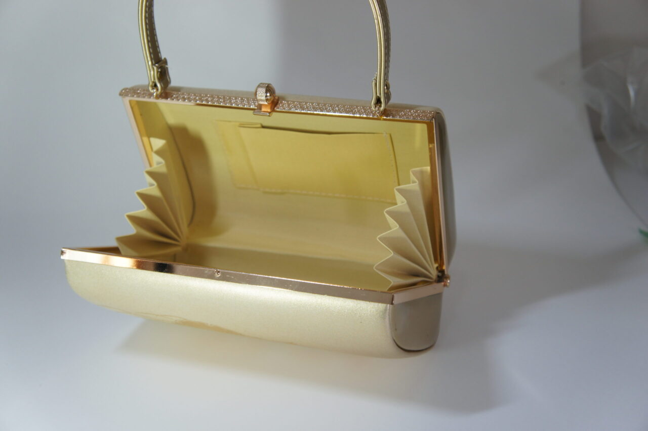 inside of gold-colored kimono clasp bag