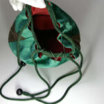 inside of green kimono drawstring pouch called "Kinchaku"