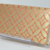 back side of gold strings kimono bag